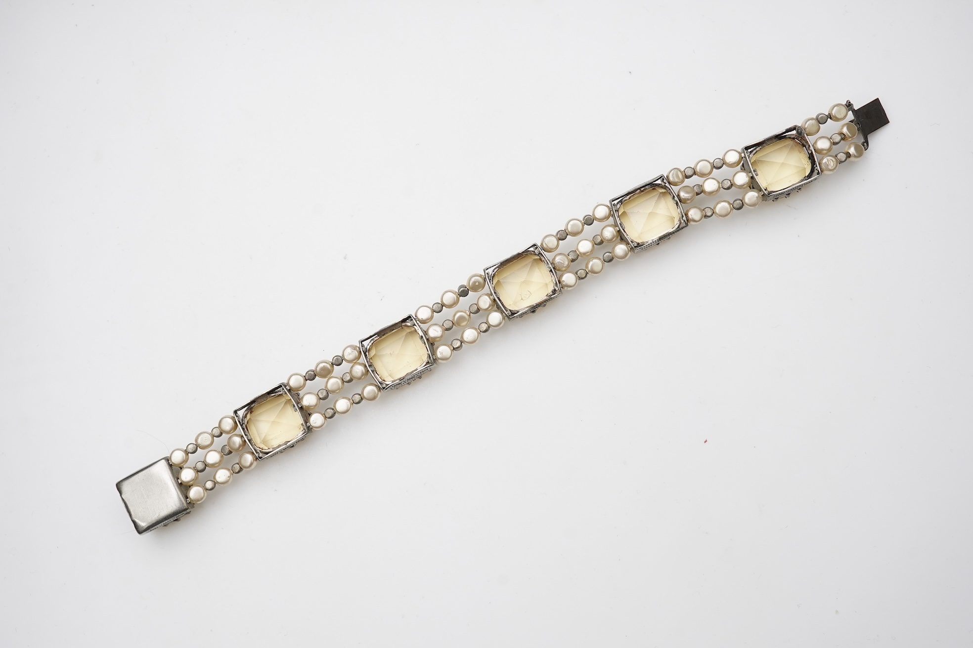 A collection of citrine jewels and a paste bracelet